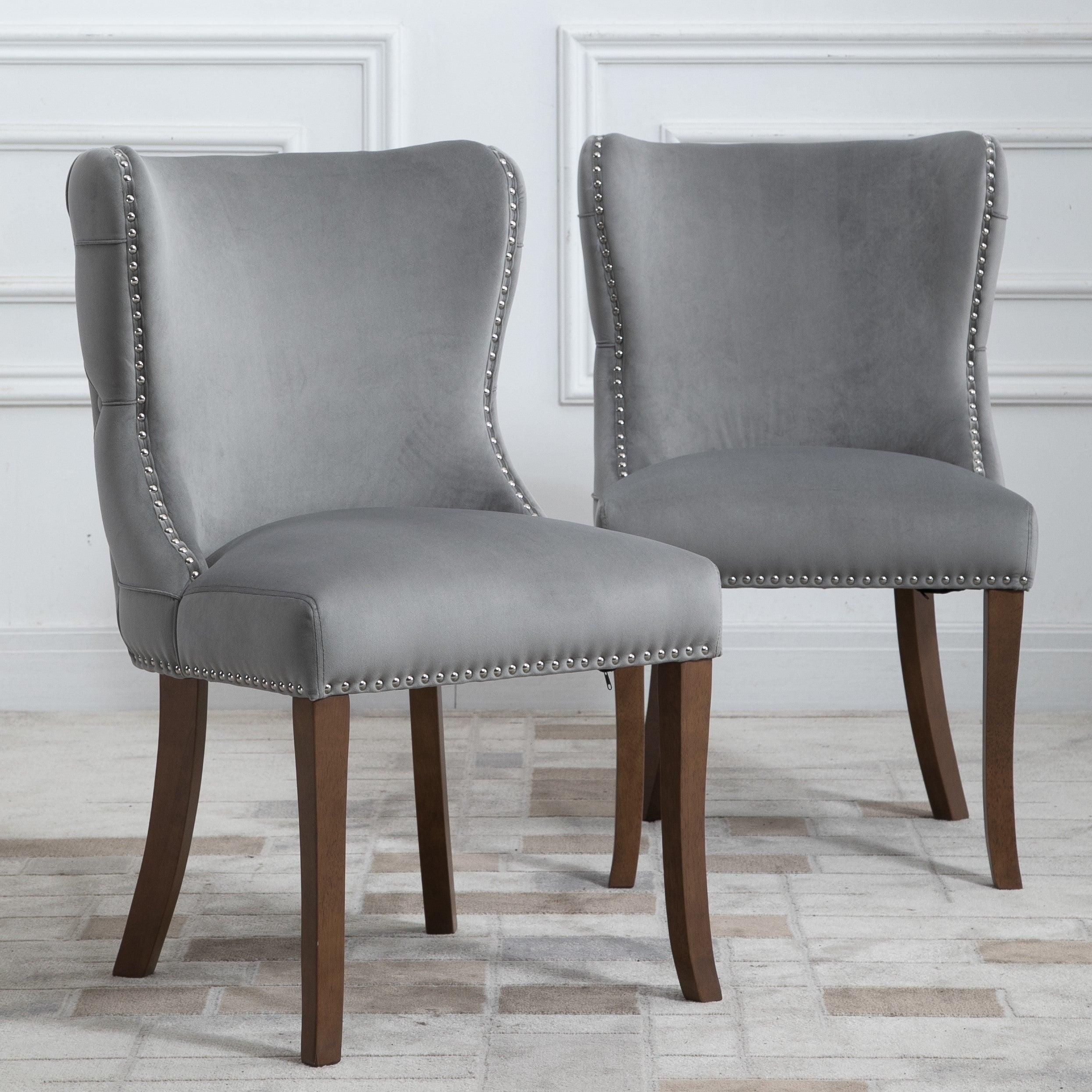 Set of 2 upholstered wing-back dining chair with backstitching nailhead trim and solid wood legs